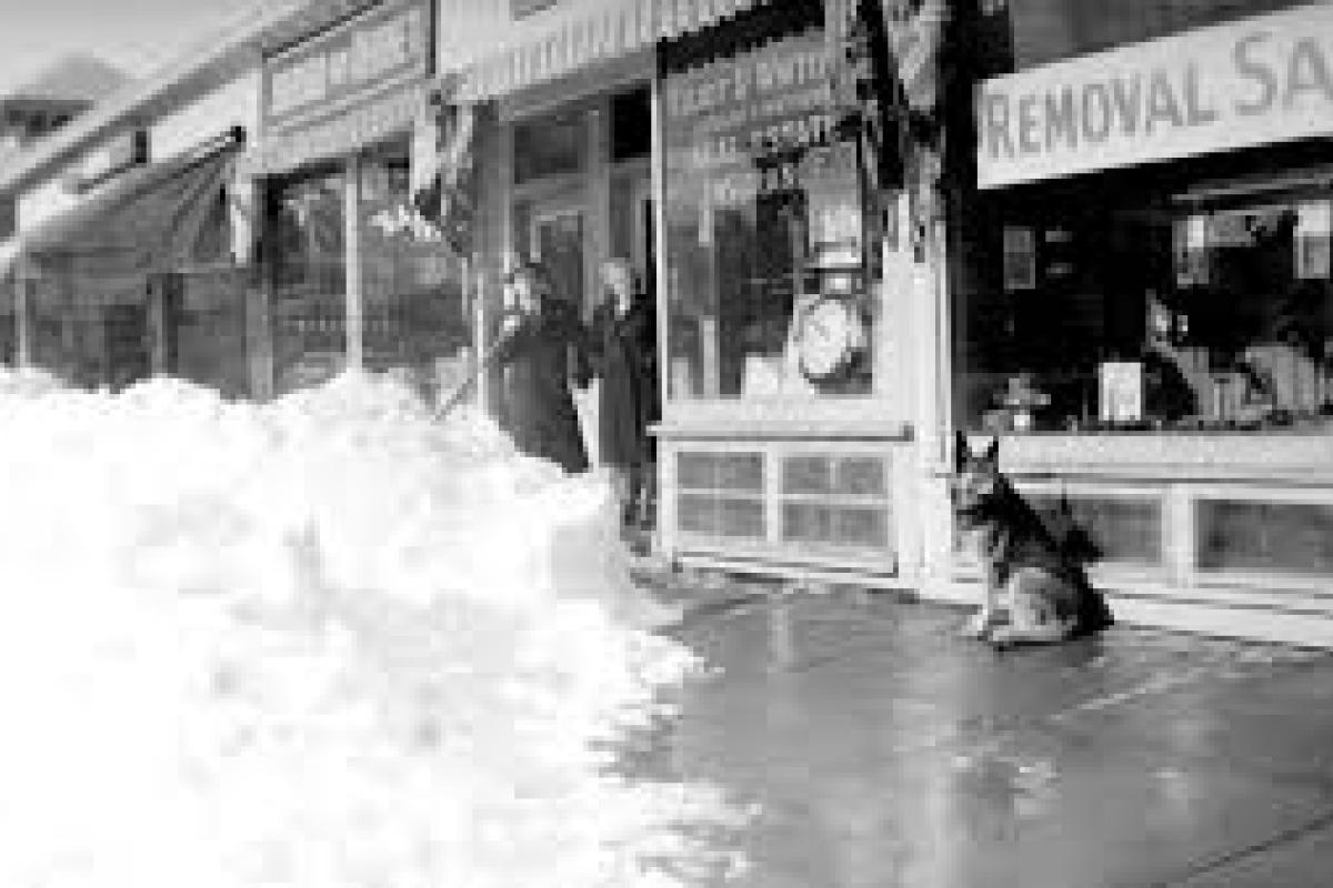 Lots of snow in front of stores